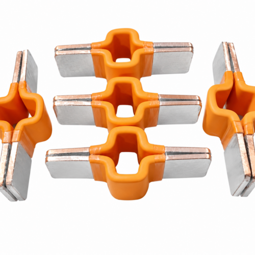 Overmolded copper busbar connector featuring stacked copper conductors, flat metallic contact ends, and an orange insulating body. Designed for electrical connections in battery assemblies, with custom configurations for OEM integration.